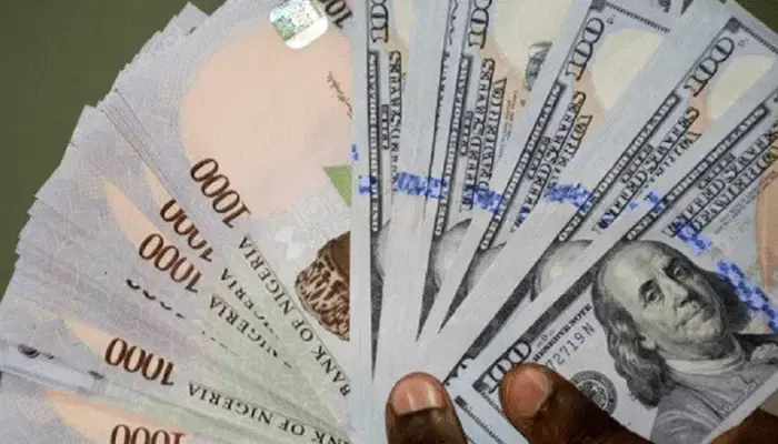 Naira falls to ₦1,555 per dollar on the parallel market.